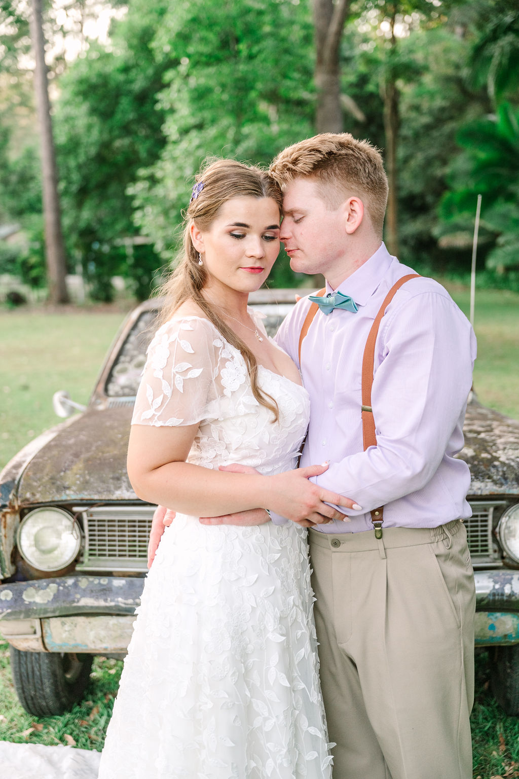 Bride and Groom in Front of old car